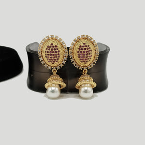 Oval Gold Stud Earrings with Pearl Drop – Rs. 1,100