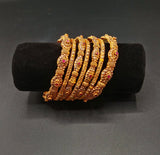 Royal Ruby Studded Antique Gold plated Bangles – Traditional Nakshi Work Jewellery Set | Heritage Bridal Bangle Collection